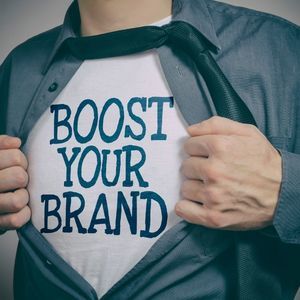 Boost Your Brand spelled out on Man's shirt